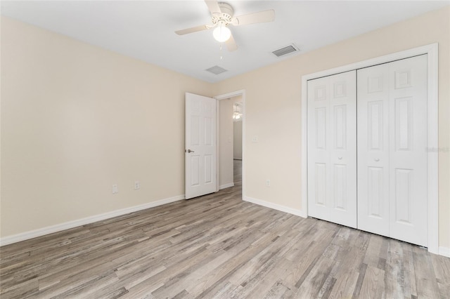 69 Juniper Trail Loop, Ocala, FL 34480 - unfurnished bedroom featuring a closet, baseboards, ceiling fan, visible vents, and light wood-style floors