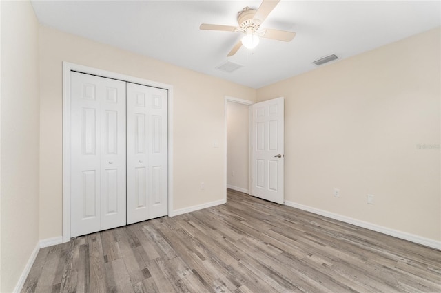 69 Juniper Trail Loop, Ocala, FL 34480 - unfurnished bedroom with a closet, baseboards, visible vents, and wood finished floors