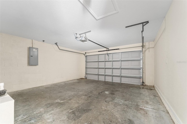 69 Juniper Trail Loop, Ocala, FL 34480 - garage with concrete block wall, electric panel, and a garage door opener