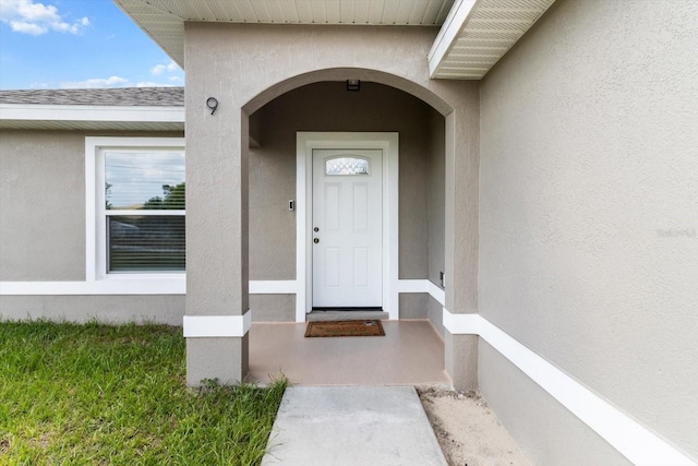 9 Walnut Run, Ocala, FL 34480 - view of exterior entry with stucco siding