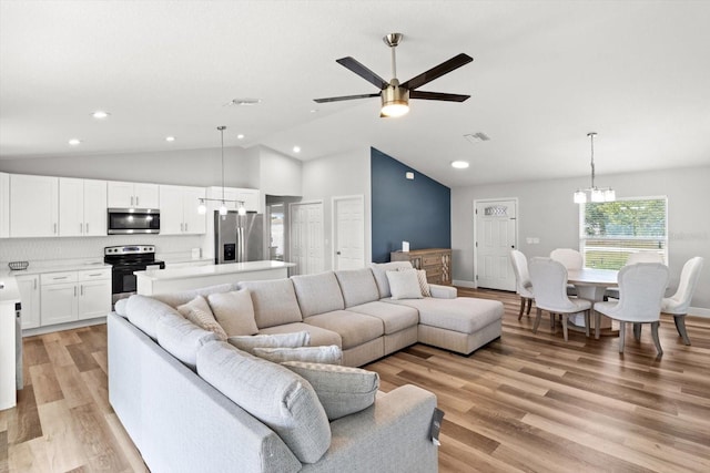 9 Walnut Run, Ocala, FL 34480 - living area featuring recessed lighting, visible vents, ceiling fan with notable chandelier, vaulted ceiling, and light wood-type flooring