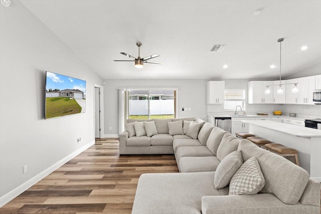 9 Walnut Run, Ocala, FL 34480 - living room featuring visible vents, light wood-style flooring, lofted ceiling, and recessed lighting