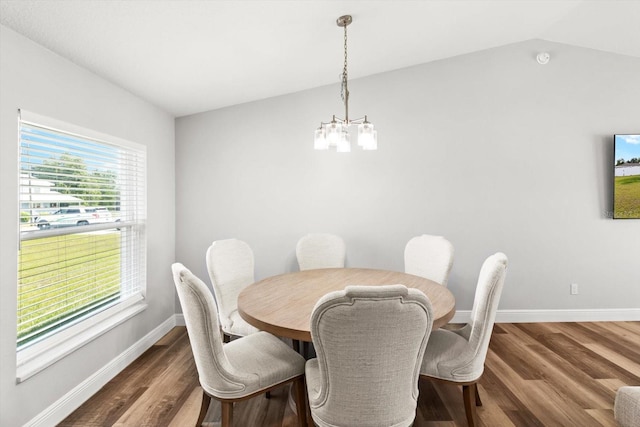 9 Walnut Run, Ocala, FL 34480 - dining area featuring lofted ceiling, a notable chandelier, baseboards, and wood finished floors