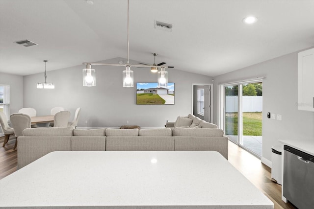 9 Walnut Run, Ocala, FL 34480 - living room with dark wood finished floors, visible vents, and lofted ceiling