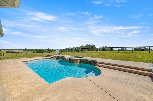 view of swimming pool featuring a yard, a pool with connected hot tub, and a patio area