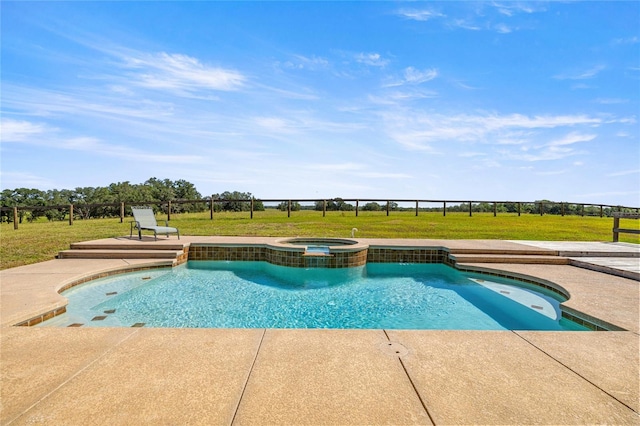 view of swimming pool featuring a lawn, a pool with connected hot tub, and a patio area