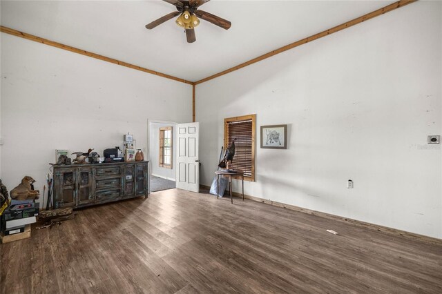 misc room featuring baseboards, ceiling fan, ornamental molding, and wood finished floors