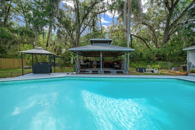 4710 SE 30th Ct, Ocala, FL 34480 - view of pool with a gazebo, fence, a fenced in pool, and a deck