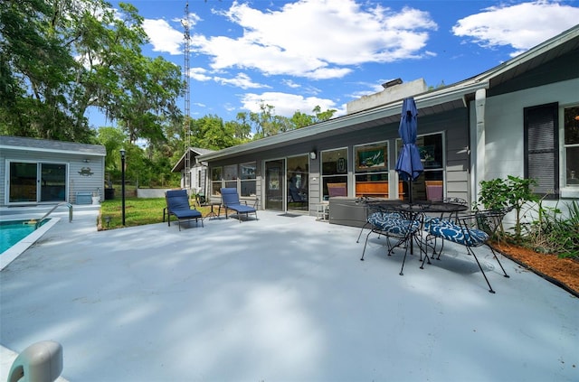 4710 SE 30th Ct, Ocala, FL 34480 - view of patio / terrace featuring outdoor dining space and an outdoor pool