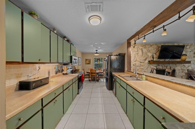 4710 SE 30th Ct, Ocala, FL 34480 - kitchen with visible vents, light countertops, a sink, appliances with stainless steel finishes, and light tile patterned floors