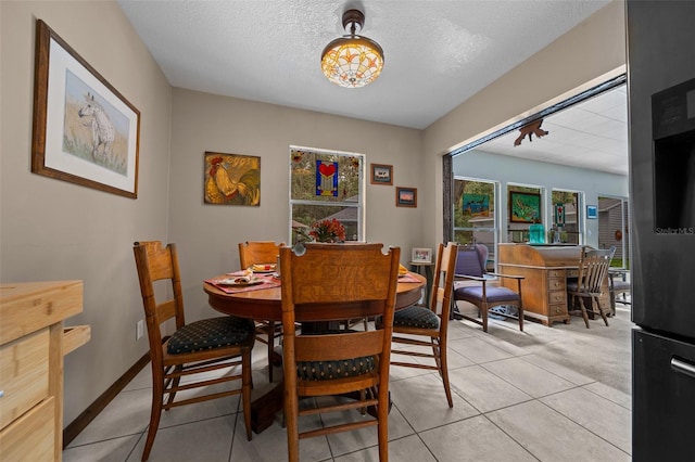 4710 SE 30th Ct, Ocala, FL 34480 - dining room with a textured ceiling and light tile patterned floors