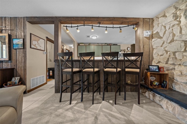4710 SE 30th Ct, Ocala, FL 34480 - dining area featuring visible vents, light tile patterned floors, and a bar