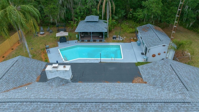 4710 SE 30th Ct, Ocala, FL 34480 - view of swimming pool with an exterior structure, a gazebo, an outdoor structure, and a fenced backyard
