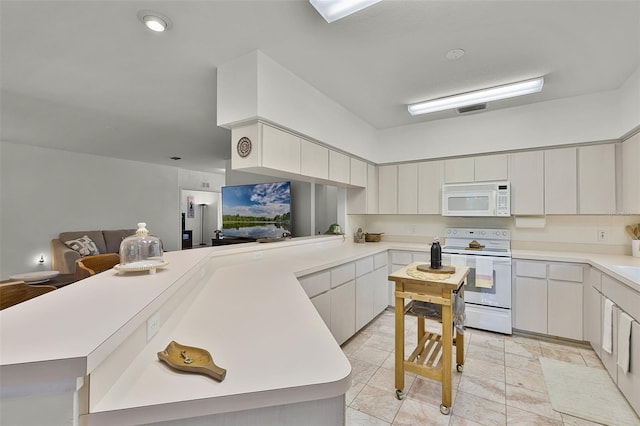 kitchen featuring white appliances, light countertops, a peninsula, light tile patterned floors, and open floor plan