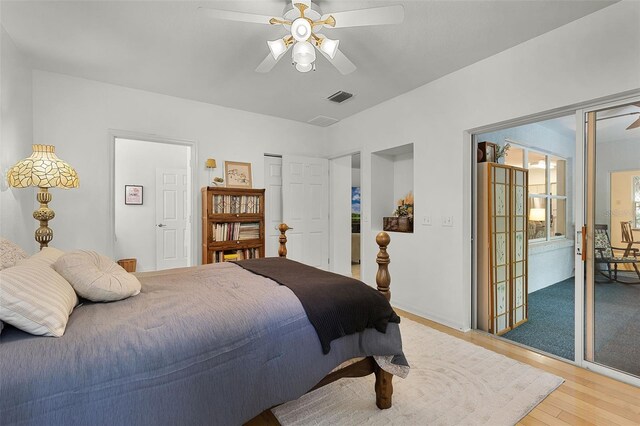 bedroom featuring light wood-type flooring and a ceiling fan