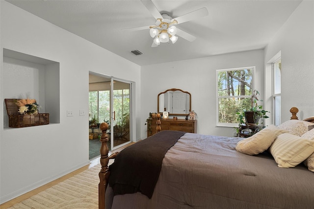 bedroom with access to outside, wood finished floors, baseboards, and a ceiling fan