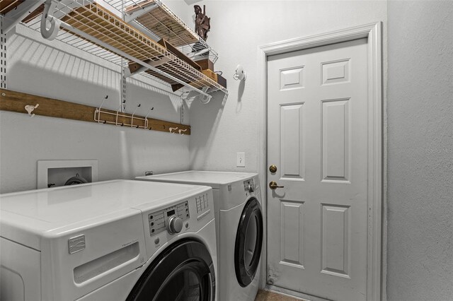 washroom with washer and dryer