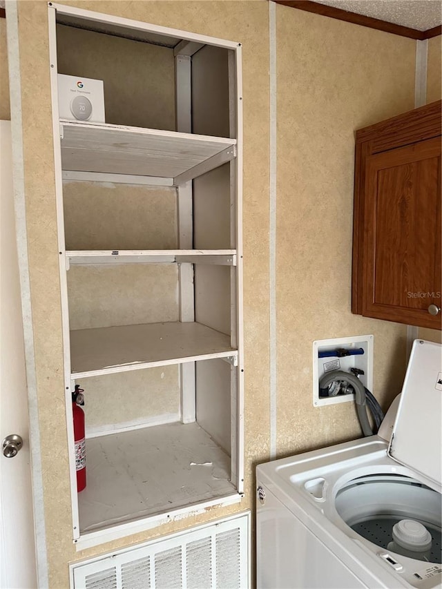 laundry area featuring washer / clothes dryer and laundry area