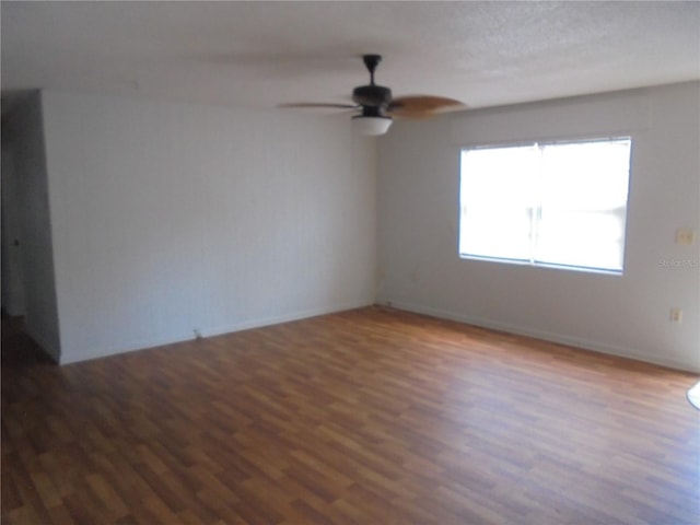 2912 NE 24th Ct, Ocala, FL 34479 - spare room featuring a ceiling fan, baseboards, and wood finished floors
