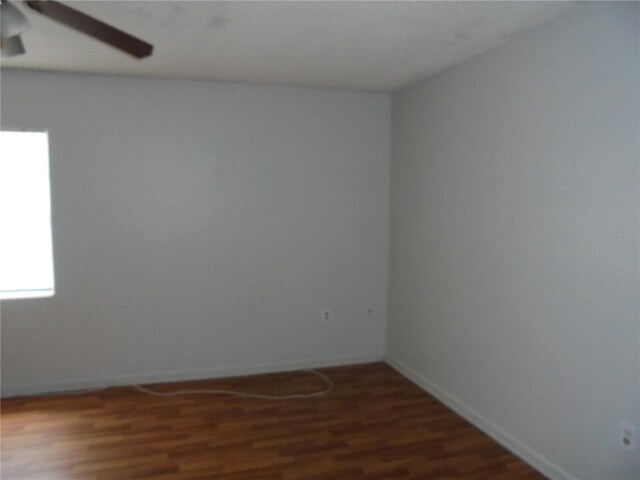 2912 NE 24th Ct, Ocala, FL 34479 - empty room with baseboards, a ceiling fan, and wood finished floors