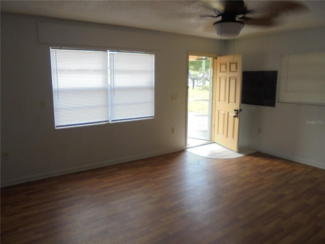 2912 NE 24th Ct, Ocala, FL 34479 - entryway with baseboards, ceiling fan, and wood finished floors