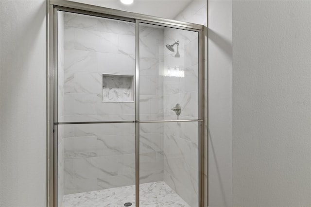 full bathroom featuring a stall shower