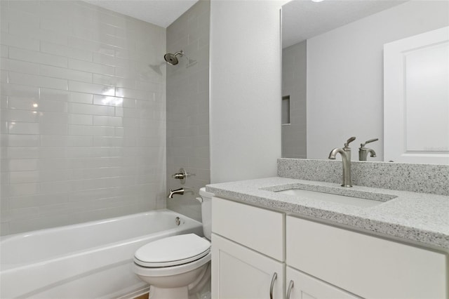 bathroom with vanity,  shower combination, and toilet