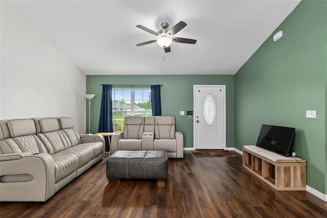 living room featuring baseboards, a ceiling fan, and wood finished floors