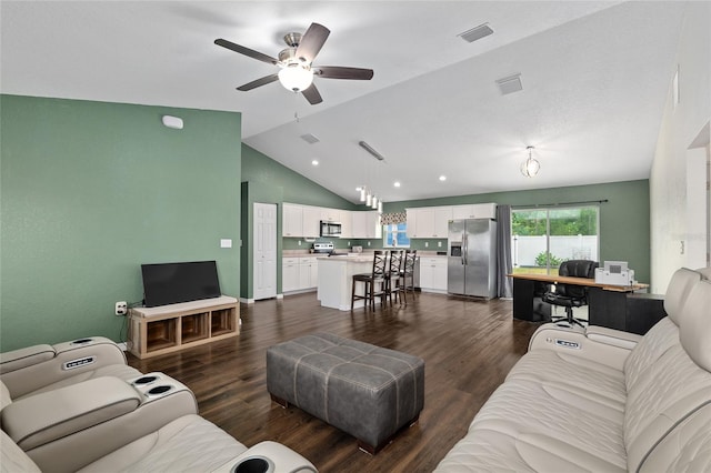 living area featuring ceiling fan, visible vents, dark wood-style floors, and lofted ceiling