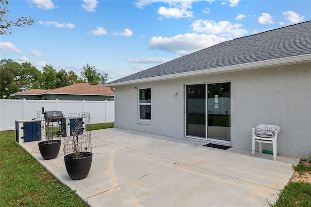 view of patio / terrace featuring fence