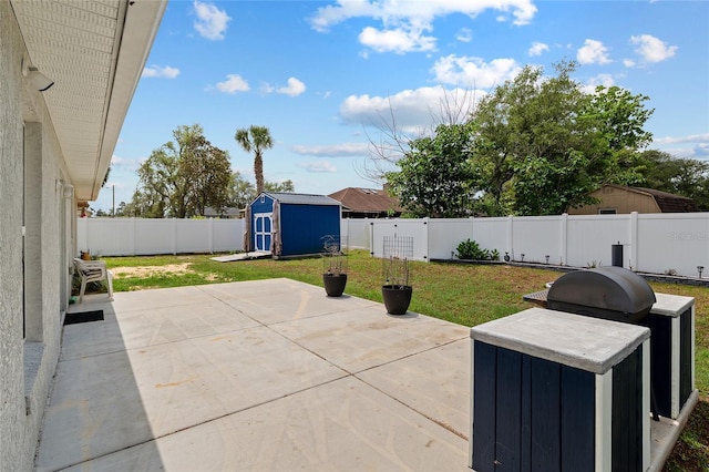 view of patio / terrace featuring a fenced backyard, an outbuilding, and a storage shed