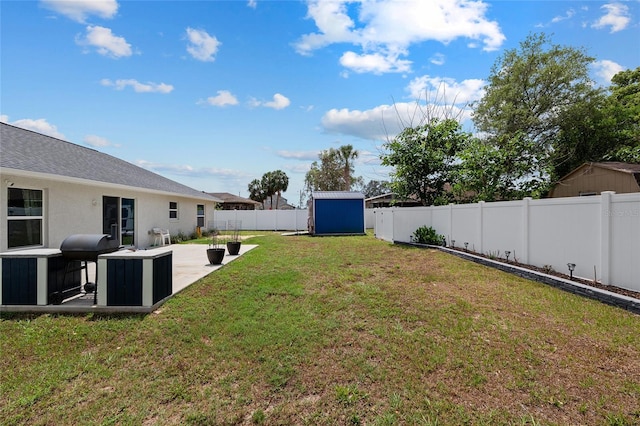 view of yard with a storage shed, an outdoor structure, a fenced backyard, and a patio area