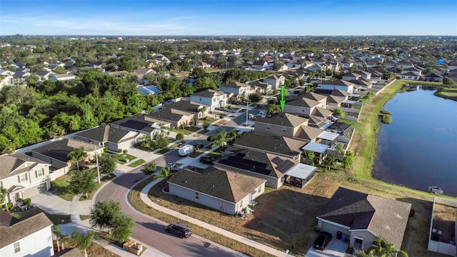 bird's eye view with a residential view and a water view