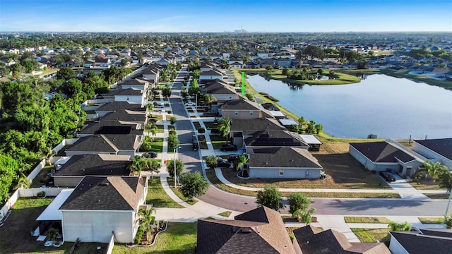bird's eye view with a water view and a residential view