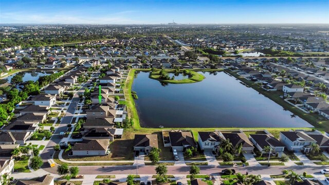 birds eye view of property with a water view and a residential view