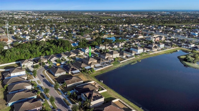 birds eye view of property featuring a water view and a residential view