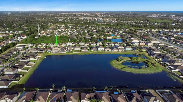 birds eye view of property featuring a residential view and a water view