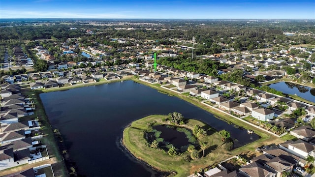 drone / aerial view featuring a water view and a residential view