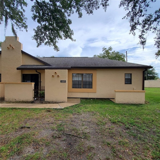 exterior space with fence and stucco siding