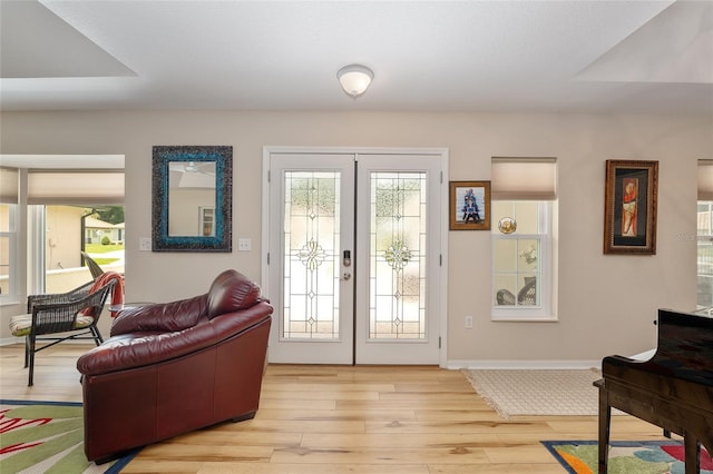 6858 SW 111th Loop, Ocala, FL 34476 - doorway to outside with baseboards, french doors, and light wood finished floors