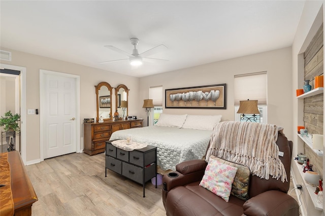 6858 SW 111th Loop, Ocala, FL 34476 - bedroom with a ceiling fan, light wood-type flooring, and visible vents