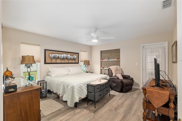 6858 SW 111th Loop, Ocala, FL 34476 - bedroom featuring ceiling fan, light wood finished floors, and visible vents