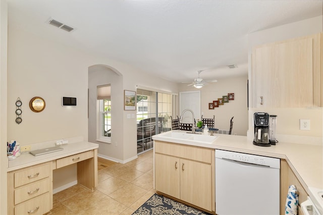 6858 SW 111th Loop, Ocala, FL 34476 - kitchen featuring visible vents, white dishwasher, a sink, a peninsula, and light brown cabinets