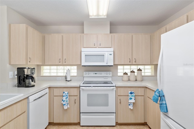 6858 SW 111th Loop, Ocala, FL 34476 - kitchen featuring white appliances, light countertops, and light brown cabinets
