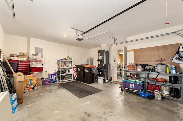 6858 SW 111th Loop, Ocala, FL 34476 - garage with heating unit, water heater, and a garage door opener