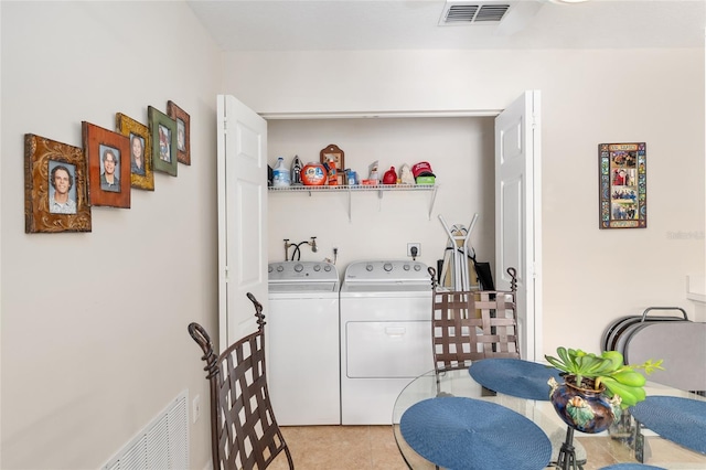 6858 SW 111th Loop, Ocala, FL 34476 - washroom with laundry area, independent washer and dryer, light tile patterned floors, and visible vents