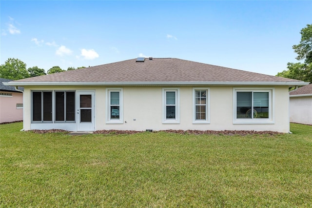 6858 SW 111th Loop, Ocala, FL 34476 - rear view of house with roof with shingles, stucco siding, and a yard