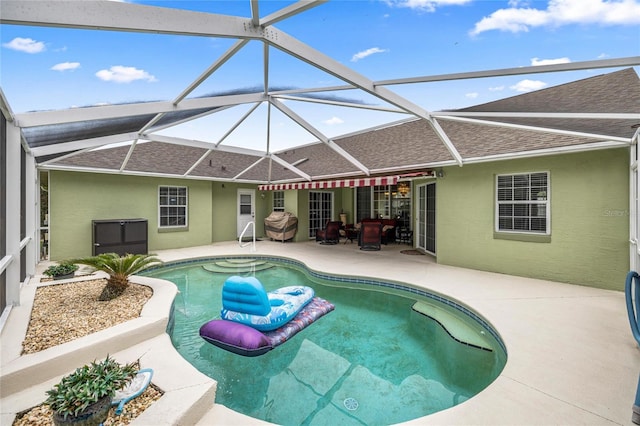 4966 SW 107th Loop, Ocala, FL 34476 - outdoor pool featuring a patio and glass enclosure