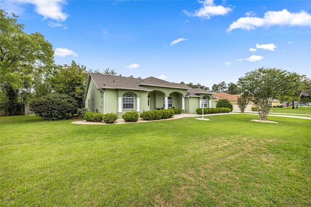 4966 SW 107th Loop, Ocala, FL 34476 - view of front of house with stucco siding and a front yard
