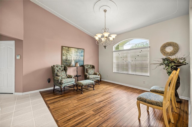 4966 SW 107th Loop, Ocala, FL 34476 - living area with a chandelier, lofted ceiling, baseboards, and light wood-type flooring